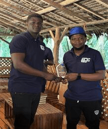 Receiving an award alongside a teammate