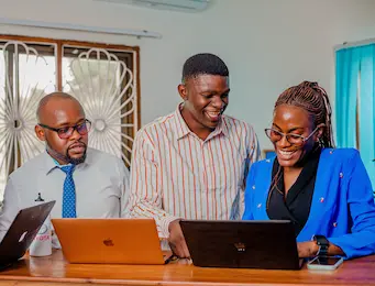 Collaborating with teammates on laptops